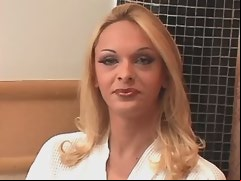 Winsome blonde shemale masturbates solo on chair